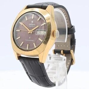 Vintage Stellaris Brown Sunburst Day Date Men's Electronic Wristwatch Gold Tone